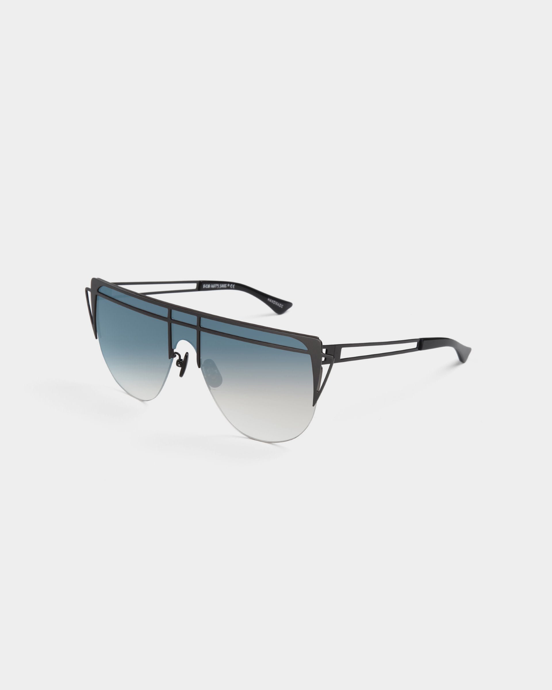 A pair of Alien sunglasses by For Art&#39;s Sake® features a sleek black metal frame and a double-bridge design. The gradient tinted lenses offer UV protection, transitioning from dark blue at the top to clear at the bottom. The temples are slender with a minimalist design, adding an extra touch of sophistication.
