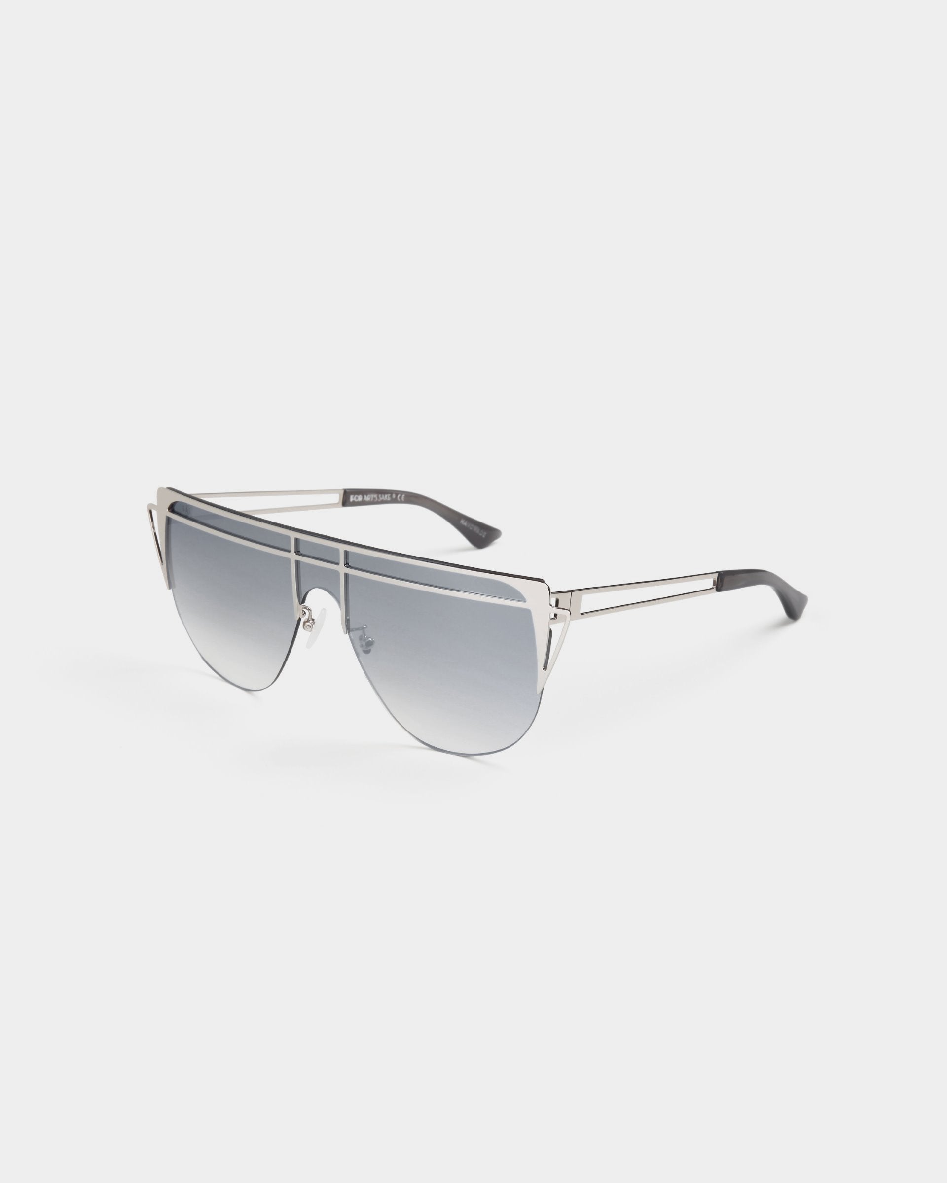 A pair of stylish aviator sunglasses with gradient lenses and a slender, handmade gold-plated stainless steel frame featuring a double bridge. The temples are black at the ends and subtly branded along the arms. The nose pads are adjustable for a comfortable fit, offering 100% UV protection. These are the Alien sunglasses by For Art&#39;s Sake®.