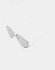 A pair of stylish, reflective Dark Eyes sunglasses from For Art's Sake® with thin stainless steel frames and lightly tinted nylon lenses offering UV protection is displayed against a plain white background. The design is minimalist and sleek.