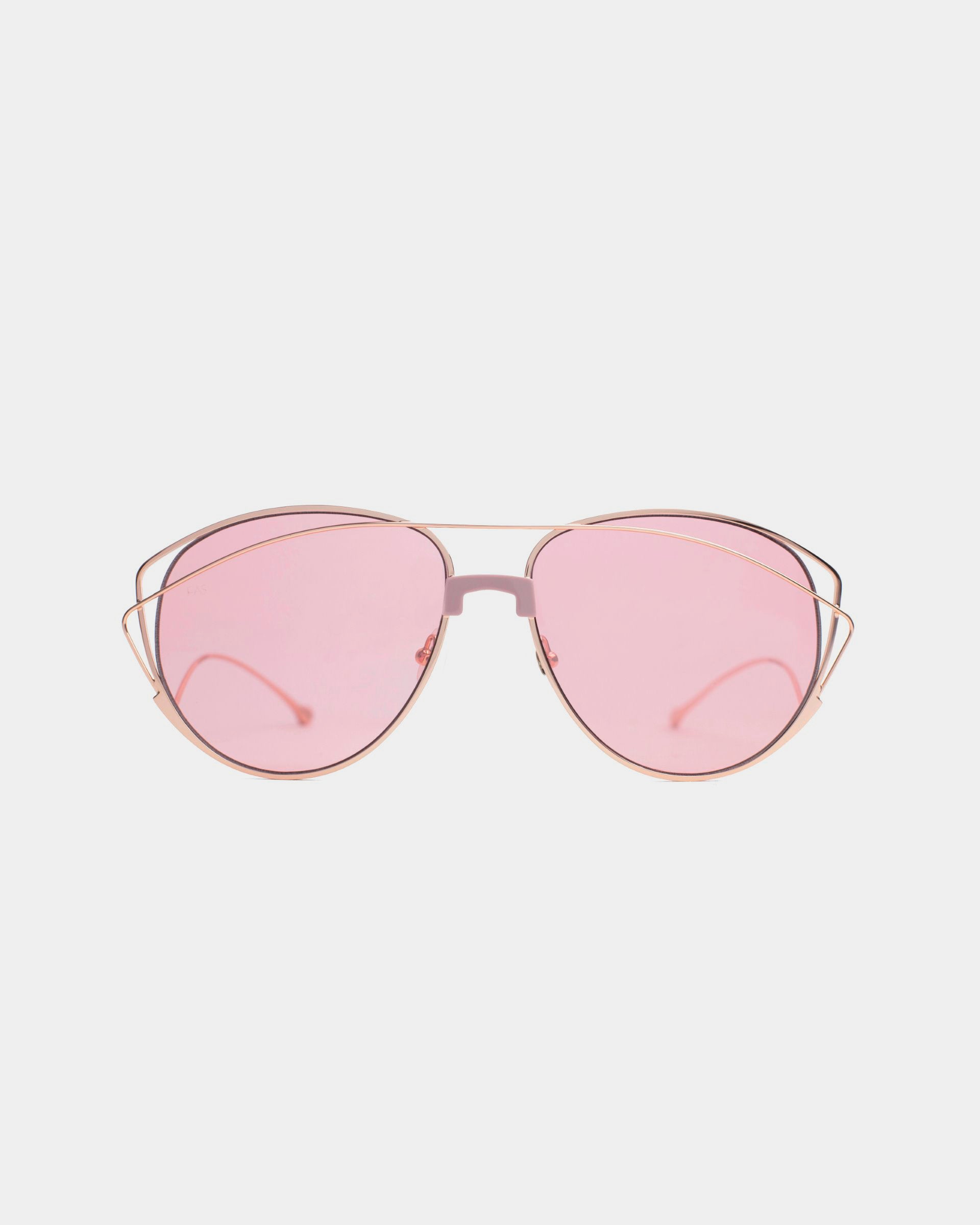 A pair of stylish For Art&#39;s Sake® Dark Eyes sunglasses with pink-tinted nylon lenses and gold stainless steel frames. The design features a double bridge and thin, curved temples, offering 100% UV protection. The background is white.