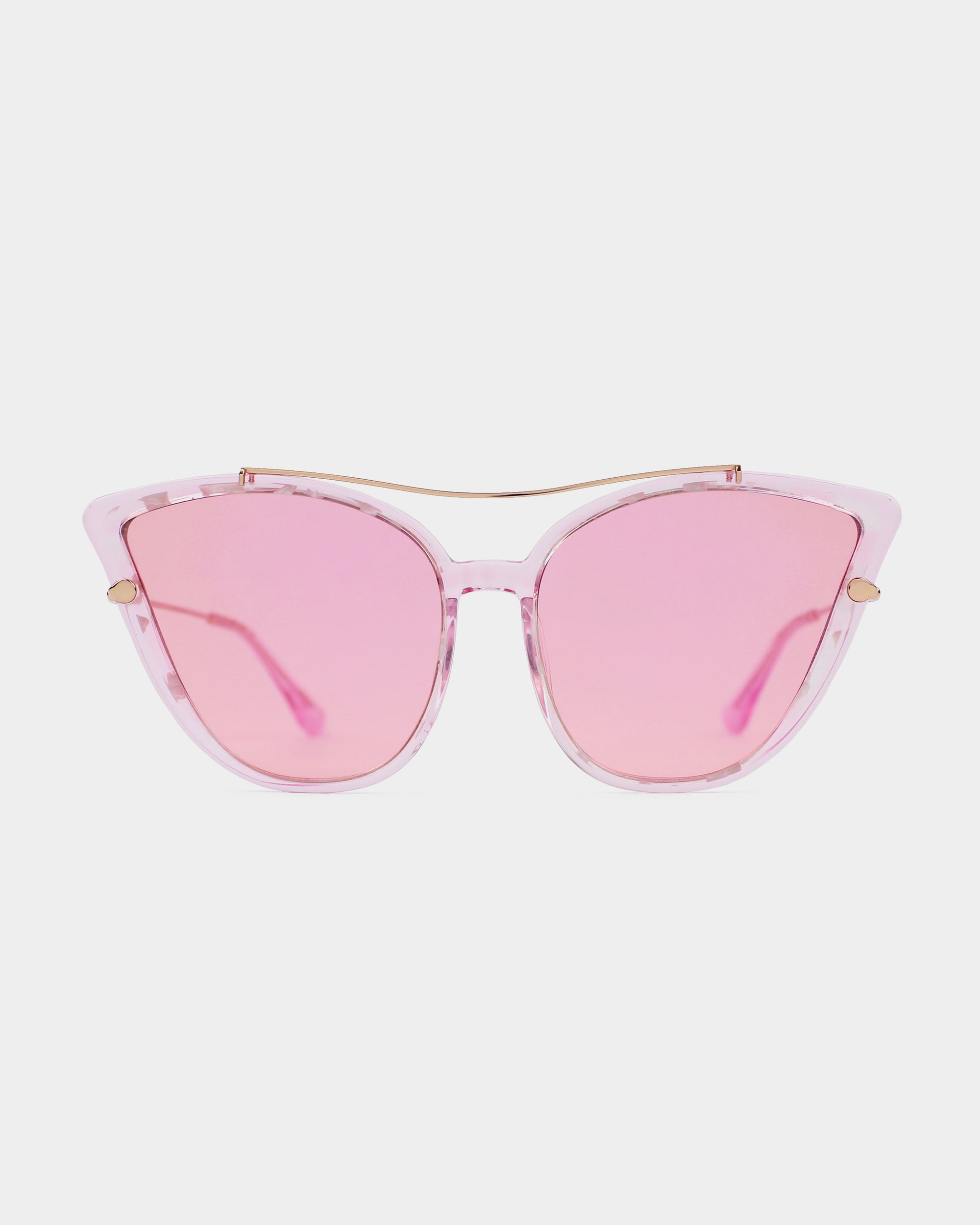 The For Art&#39;s Sake® T Two sunglasses feature clear pink acetate cat-eye frames and pink-tinted lenses, shown from the front against a white background. The striking cat-eye design is enhanced by delicate gold accents at the top and on the temples, providing 100% UV protection.