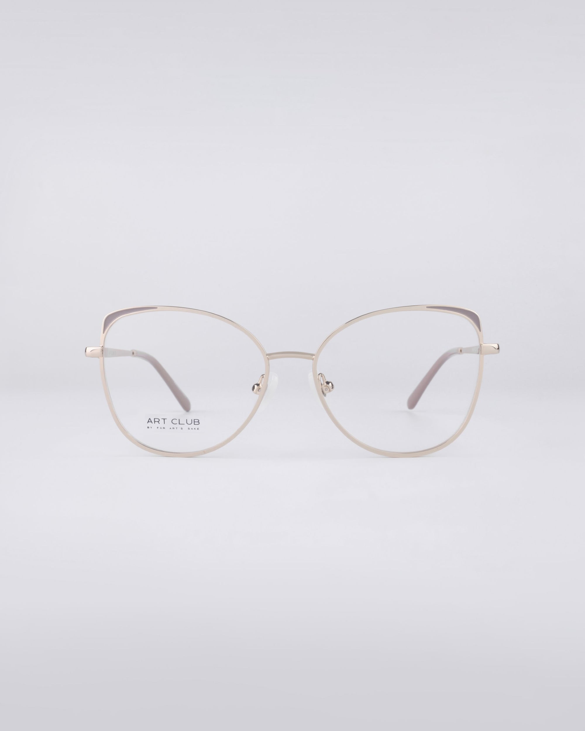 The Ada eyeglasses from For Art's Sake® showcase a sleek, minimalist design with thin frames crafted from durable stainless steel. Against a light gray background, the round lenses are equipped with a blue light filter for modern protection and style.