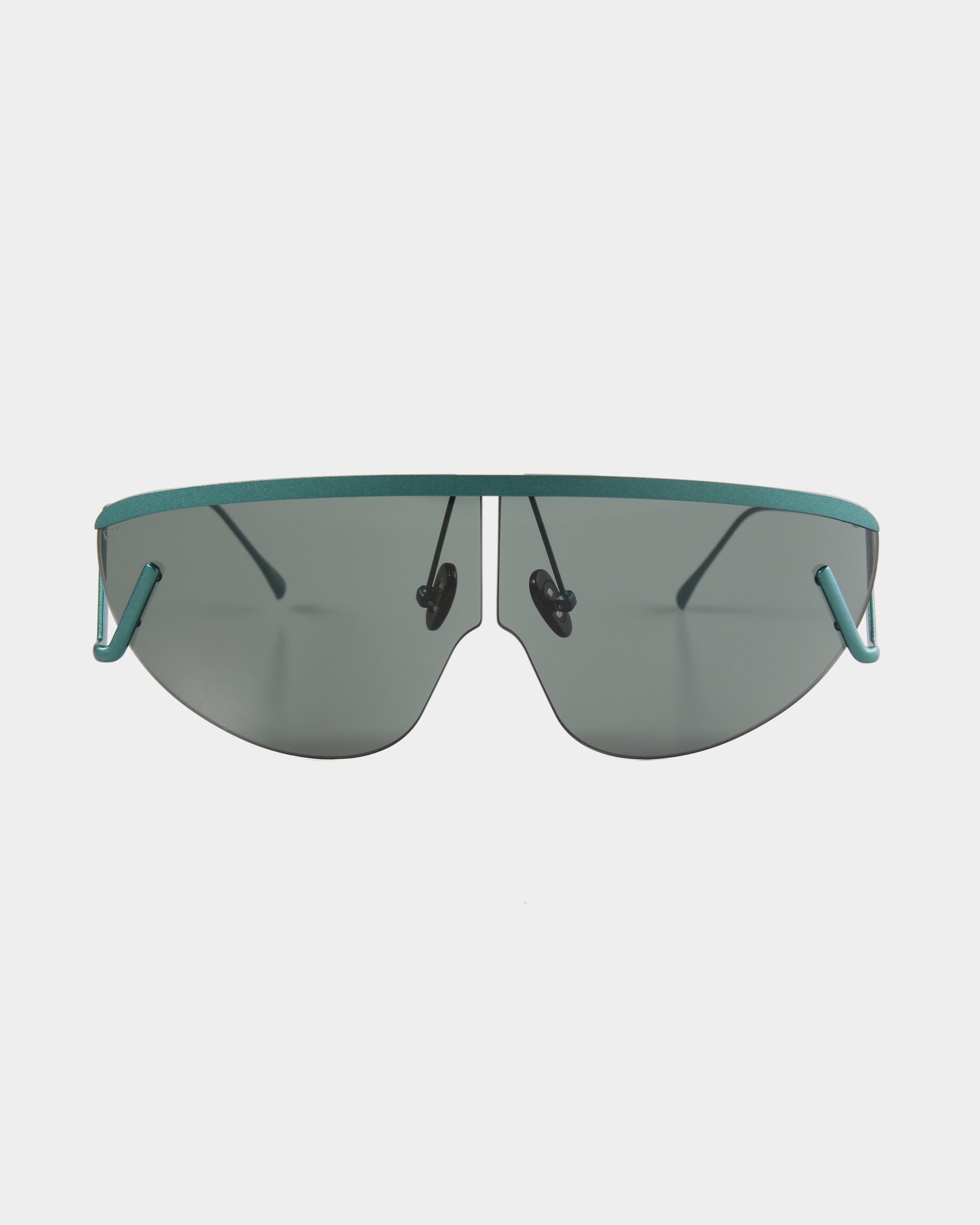 A pair of futuristic, UV-protected rectangular sunglasses with green-tinted lenses and slim, teal-colored metal frames. The temples and nose pads are also teal, giving the ultralightweight For Art's Sake® Air Green sunglasses a sleek and modern appearance. The background is plain white.