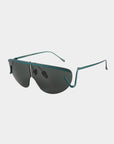 A pair of modern, stylish Air Green sunglasses by For Art's Sake® with dark lenses and a sleek, green metal frame. These ultralightweight UV protected sunglasses feature thin arms and a semi-rimless style with wrap-around temple tips, creating a fashionable and contemporary look.