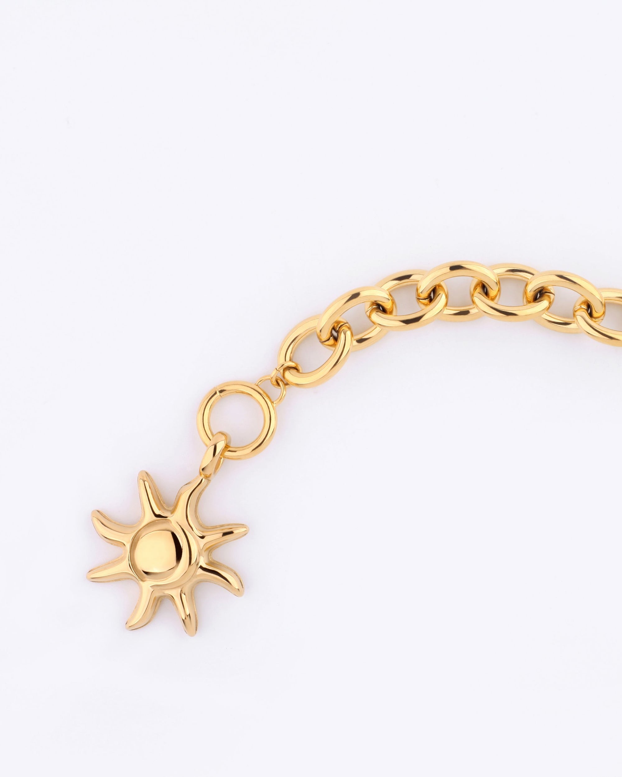 A Crescent Moon Bracelet by For Art&#39;s Sake®, measuring 20cm in length, features a sun-shaped charm and is displayed against a plain white background.