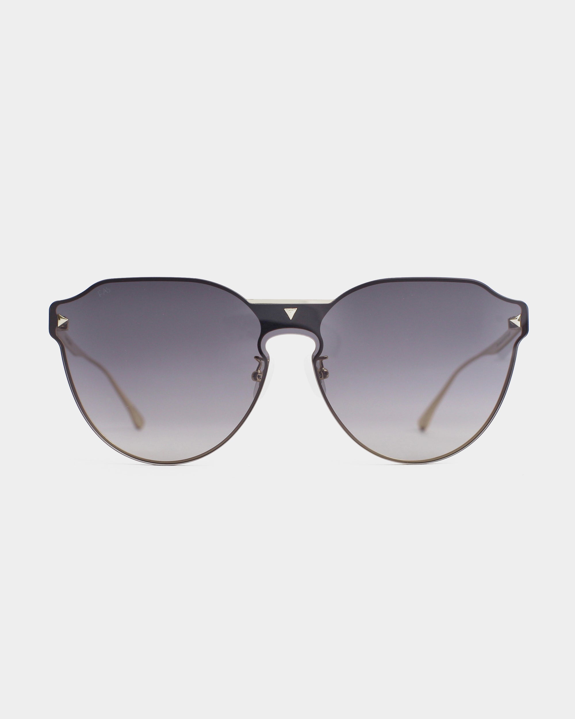 A pair of stylish For Art&#39;s Sake® Error 404 sunglasses with a black frame and gradient gray-tinted nylon lenses, offering UV protection. The design includes small metallic triangular details on the upper corners of the lenses. The sunglasses have thin, light brown arms with elegant 18-karat gold plating. The background is plain white.
