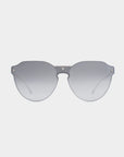 A pair of stylish, frameless Error 404 sunglasses from For Art's Sake® with large, circular, gradient gray Nylon lenses and a thin metal bridge. The temples, adorned with 18-karat gold plating, are designed in a light-colored metal, offering a sleek and modern appearance against a white background.