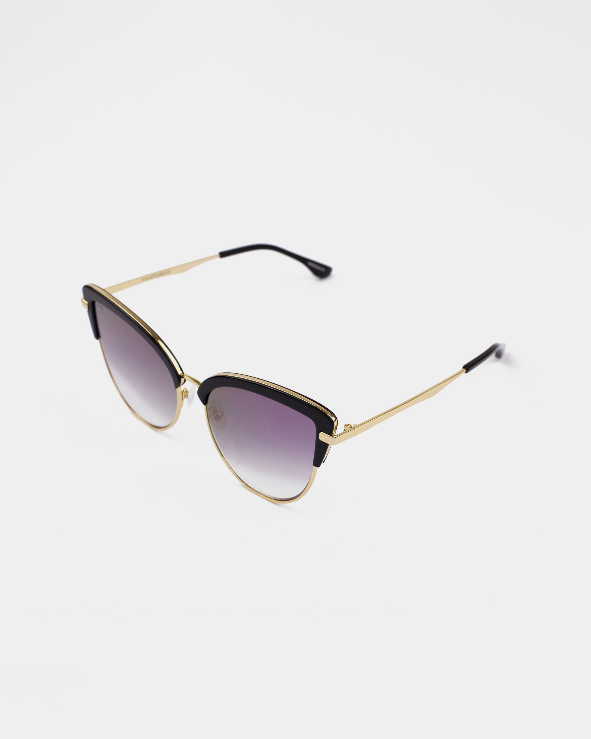 A pair of stylish For Art&#39;s Sake® Venus sunglasses with an 18-karat gold-plated black frame. The nylon lenses are gradient, transitioning from dark at the top to lighter towards the bottom. The thin arms feature black tips for added comfort. The background is plain white.