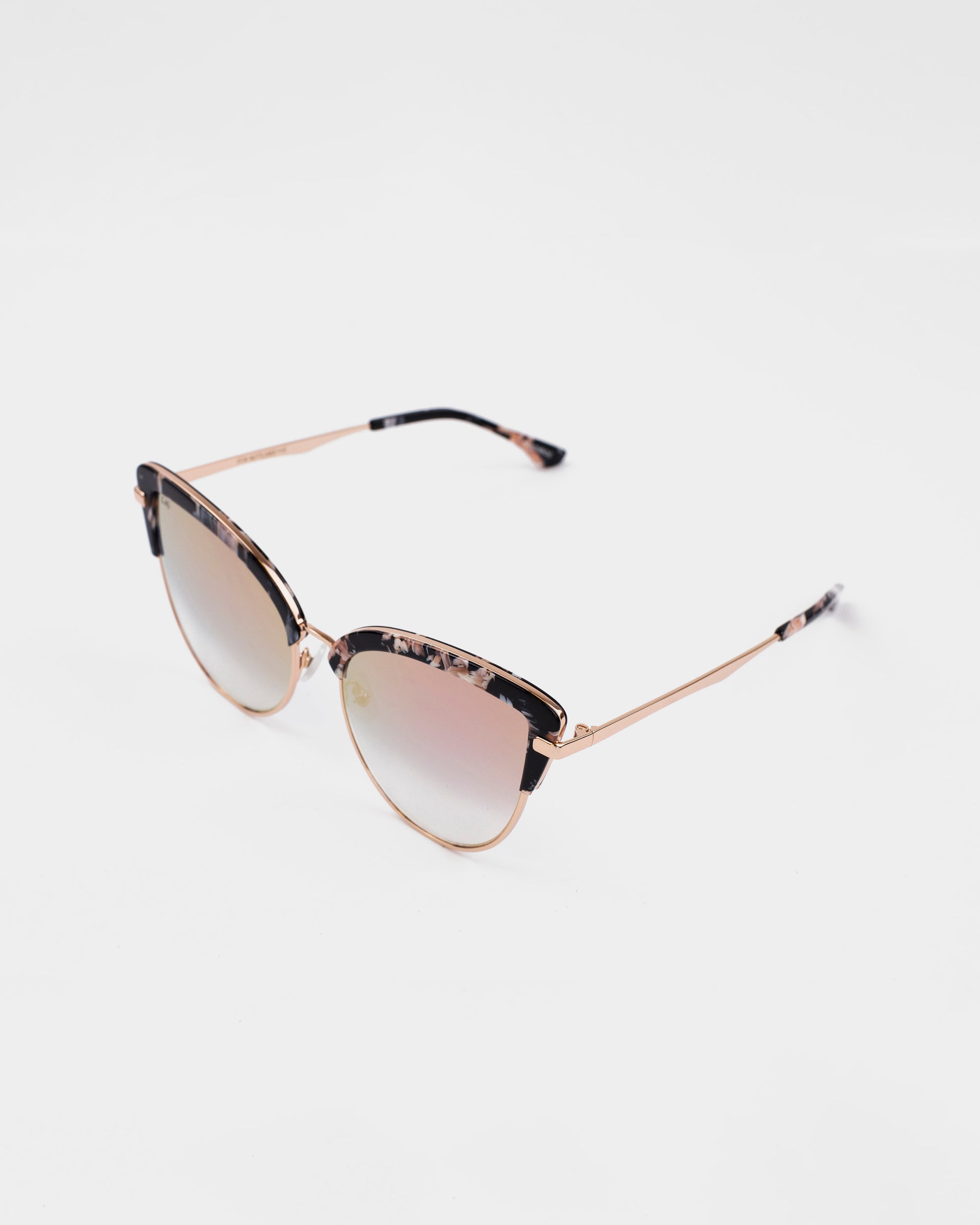 A pair of stylish For Art&#39;s Sake® Venus sunglasses with thin, 18-karat gold-plated frames and gradient nylon lenses transitioning from a darker top to a lighter bottom. The top part of the frames has a tortoiseshell pattern. The For Art&#39;s Sake® Venus sunglasses are placed against a plain white background.