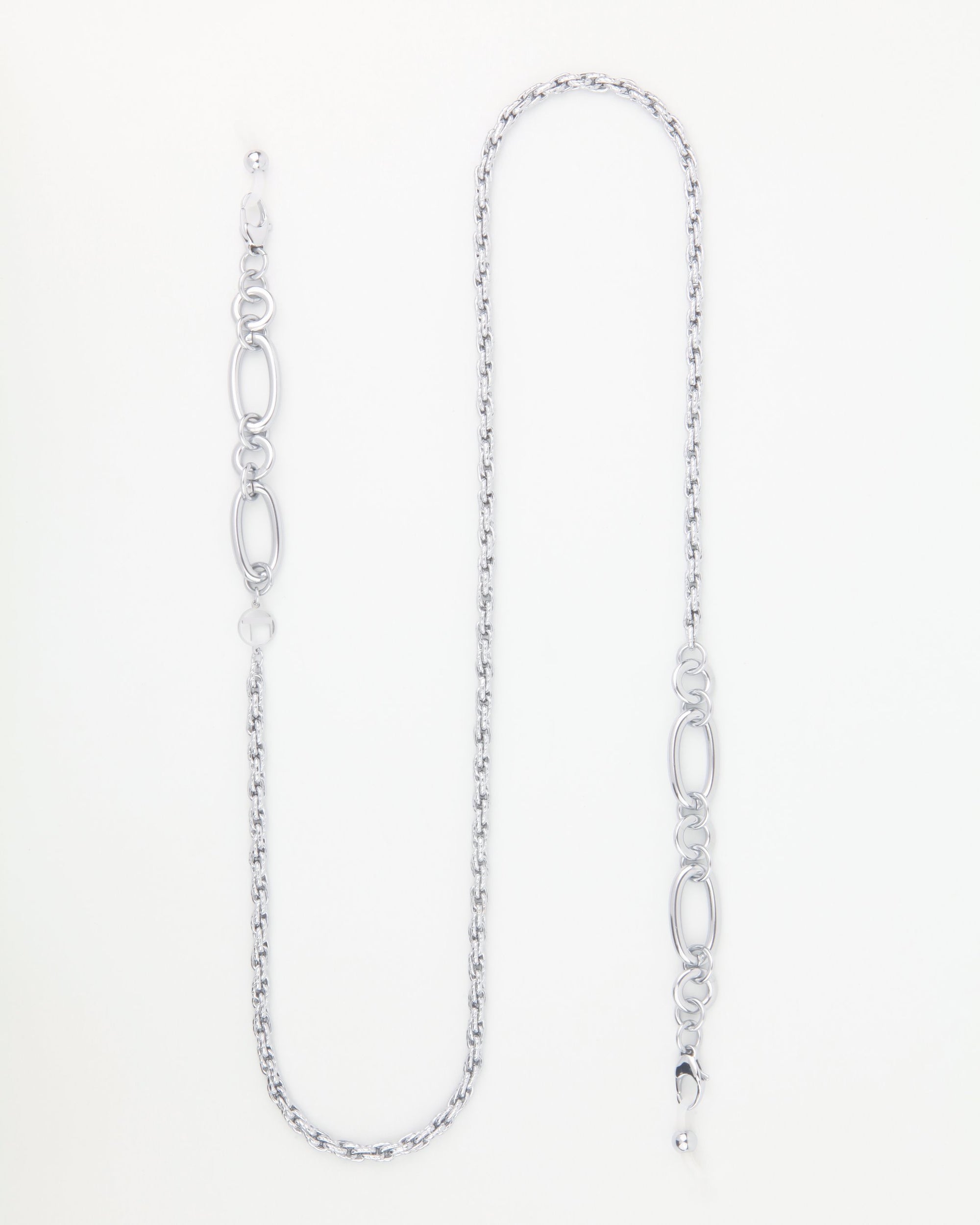 Silver chain necklace with an alternating pattern of medium-sized oval links and smaller round links. The necklace lies flat on a white background, showcasing its minimalistic design and sleek finish—perfect for pairing with the Milan Glasses Chain by For Art's Sake® for a chic look.