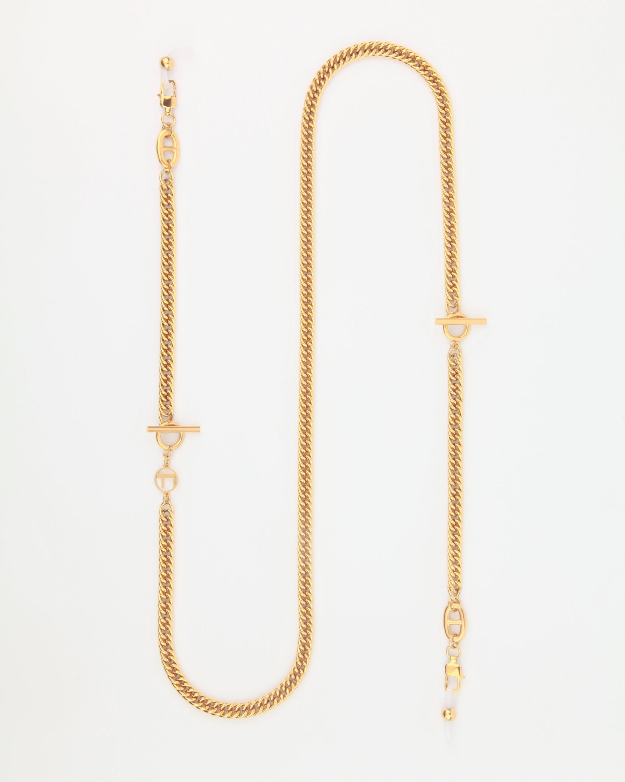 The image shows the For Art's Sake® Lisbon, an 18-karat gold chain necklace featuring a twisted rope design. The statement necklace has two T-bar clasps situated at different points along the chain and a lobster clasp at the end. The Lisbon is laid out in an elongated S-shape against a white background.