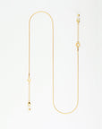 A delicate Miami Glasses Chain with a simple design, featuring small loops and a few discreet links throughout. Crafted by For Art's Sake® with 18-karat gold-plating, the chain ends in a standard clasp and a short extension chain for adjustable lengths. The background is a plain white surface.