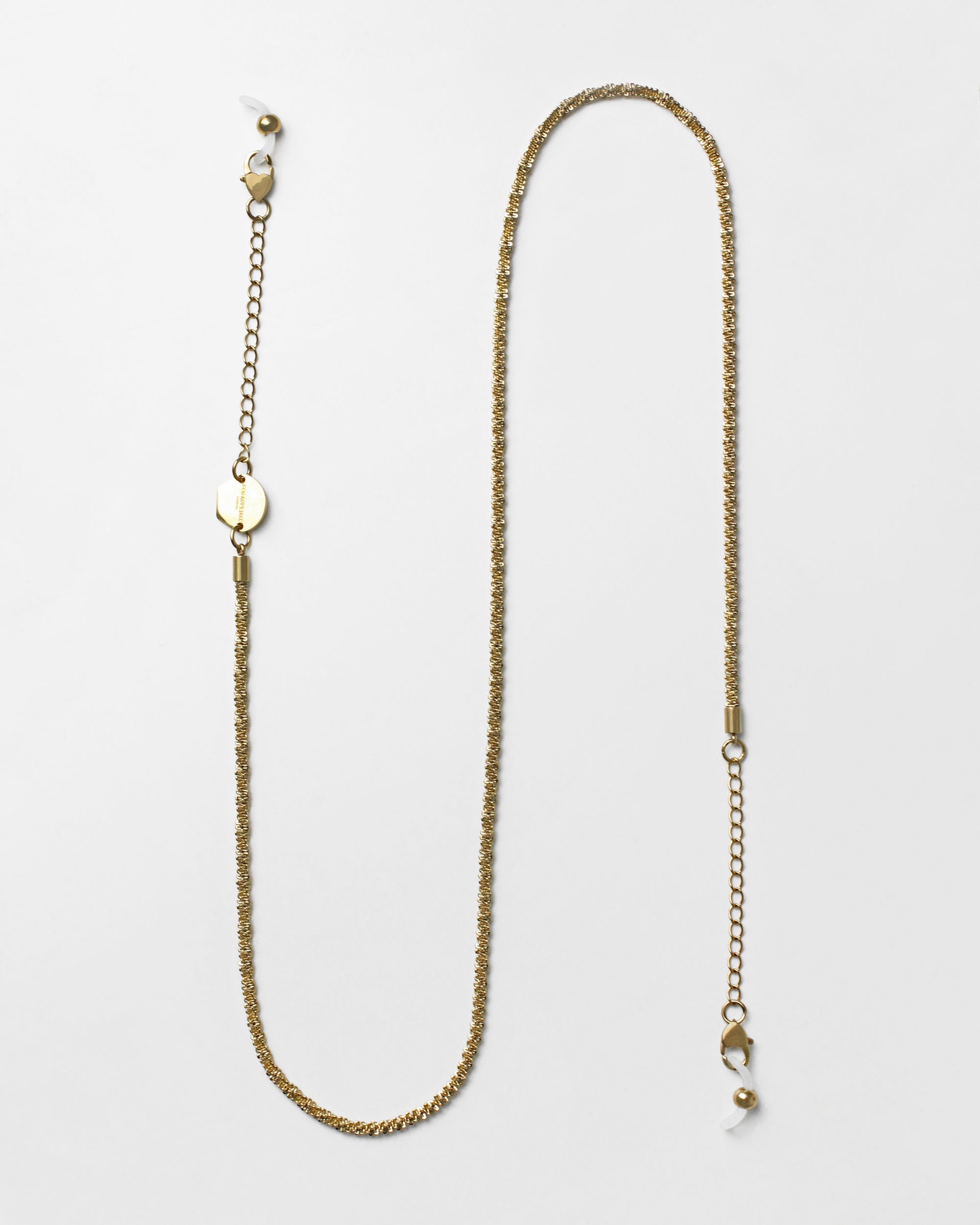 A delicate, 18k gold-plated **Mayfair Glasses Chain** with fine, intricate links and heart-shaped claw closures at both ends, designed to attach to eyeglasses. The chain also features adjustable extension links for a customizable fit. Displayed against a plain white background. Brand: **For Art&#39;s Sake®**