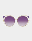 Introducing Skylar by For Art's Sake®: a pair of stylish sunglasses with round, gradient purple lenses and a gold metal frame. The design features a double bridge and sleek arms, giving it a modern and chic look against a white background. Don't miss your Last Chance to buy these stunning accessories!