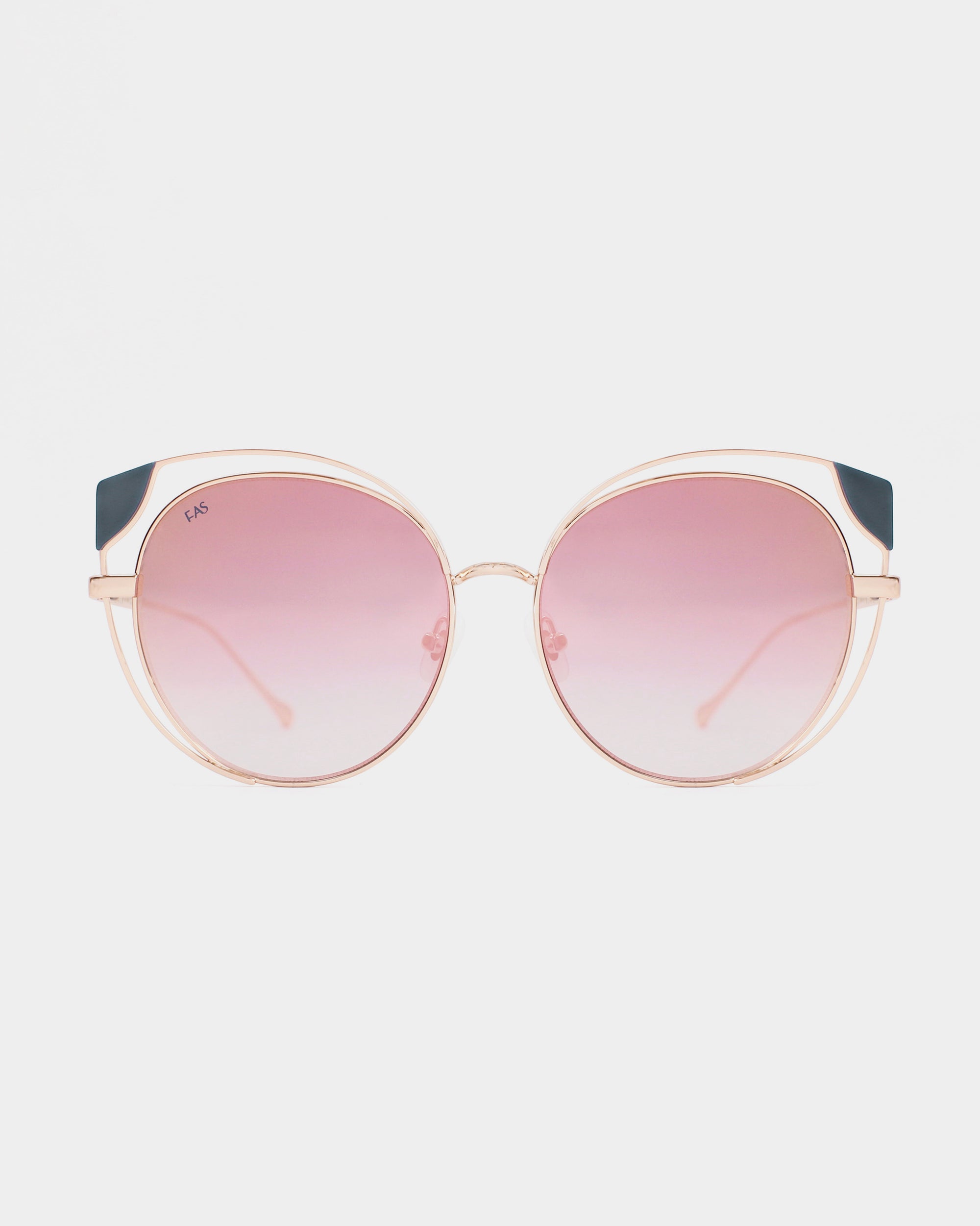 Last chance to grab a pair of stylish Skylar sunglasses from For Art&#39;s Sake®, featuring round lenses with a gradient tint that transitions from dark pink to light pink. The frames are thin and metallic with a luxurious rose gold finish, and the top corners boast exquisite dark blue accents.