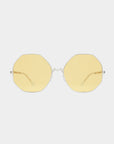 A pair of For Art's Sake® M8 sunglasses, featuring octagonal amber lenses and thin, stainless steel frames, is displayed against a plain white background.