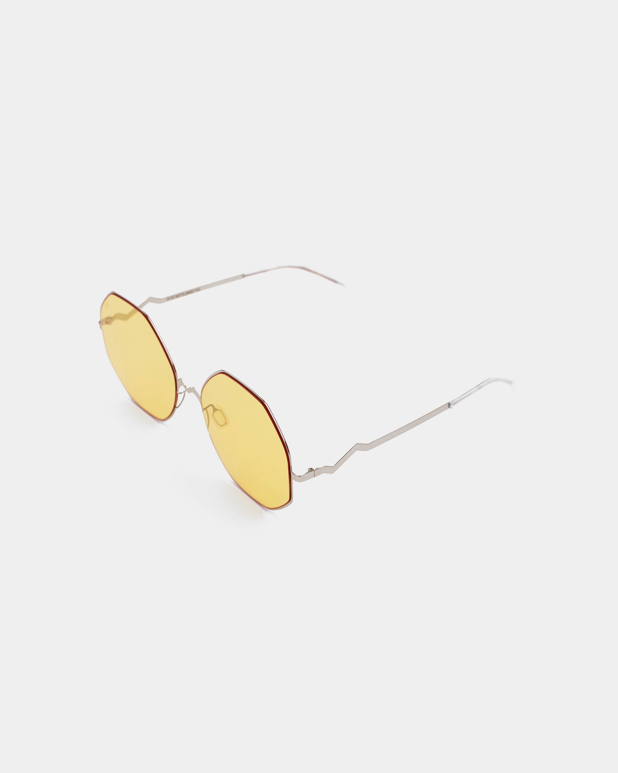 A pair of For Art&#39;s Sake® M8 sunglasses featuring round, amber-tinted lenses and thin stainless steel frames with straight temple arms, photographed against a plain white background.