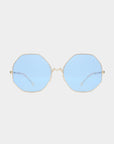 A pair of For Art's Sake® M8 sunglasses with gold-framed, octagon-shaped lenses in light blue tint, offering UV protection, shown against a plain white background.