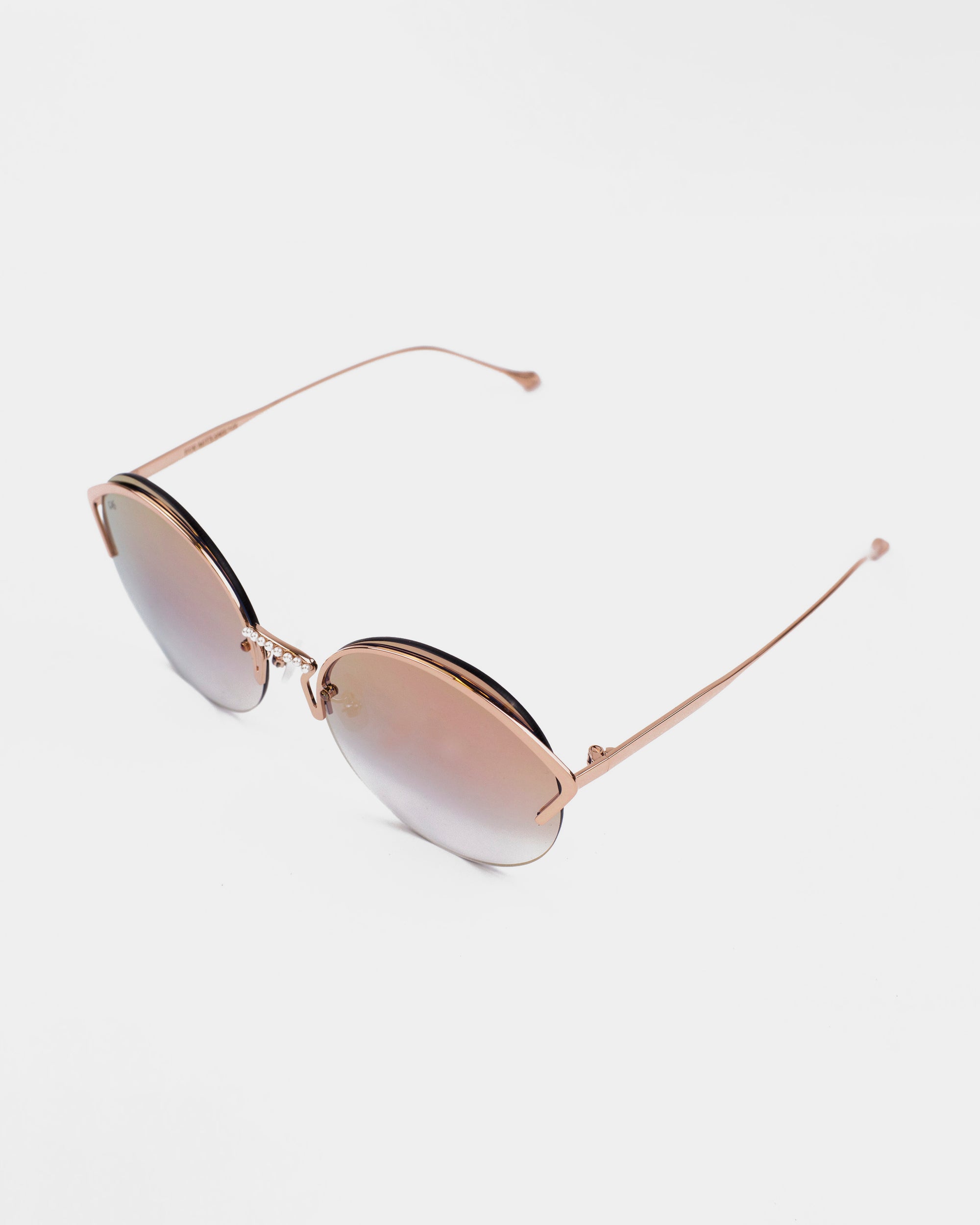 A pair of round, gold-framed For Art&#39;s Sake® Margarita sunglasses with brown gradient nylon lenses offering UV protection. The sunglasses feature thin temples and a stylish, minimalist design, set against a white background.