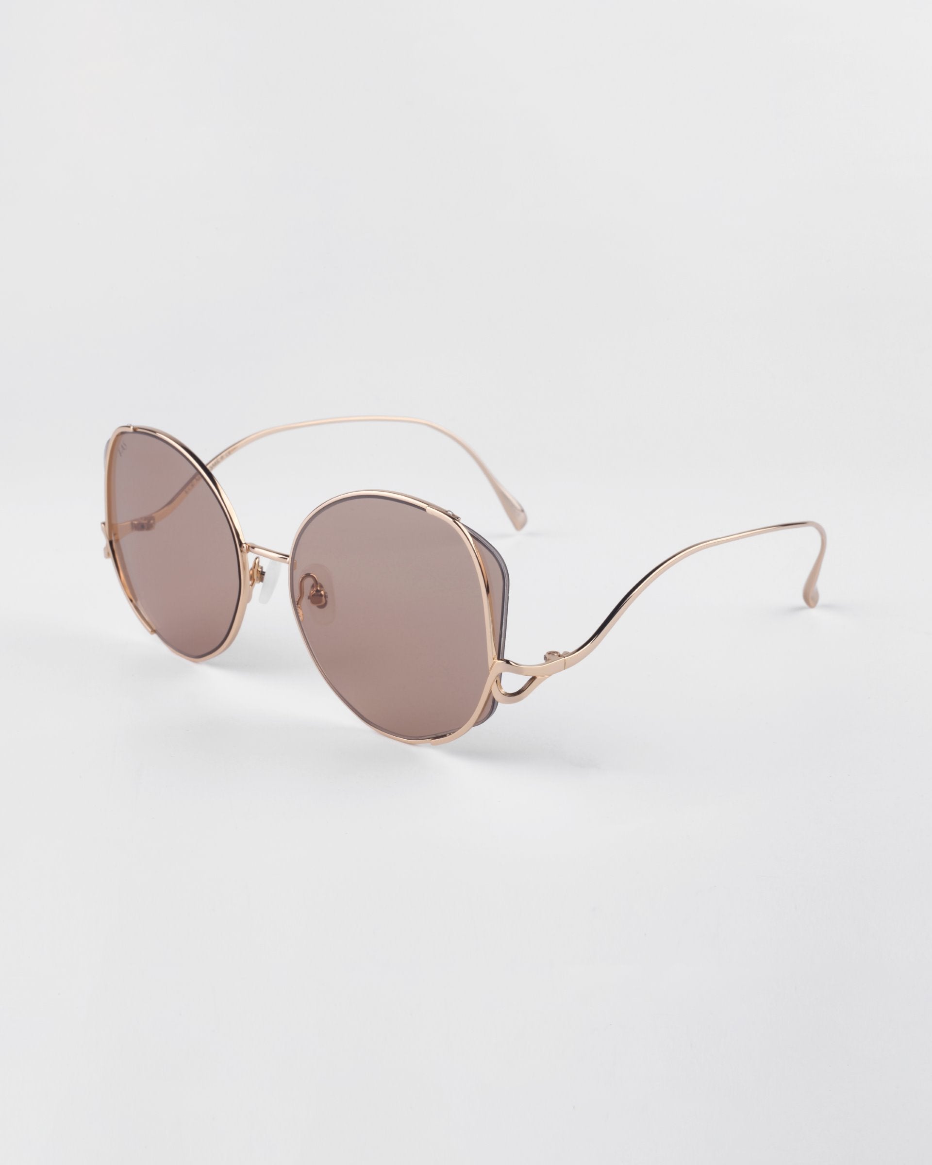 For Art&#39;s Sake &#39;Canvas&#39; sunglasses in sand. A side view image showing the gold frame details with circle shapes. 
