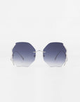 A pair of Century sunglasses from For Art's Sake® with gold-plated stainless steel thin frames. The ultra-lightweight nylon lenses offer 100% UVA & UVB protection and have a gradient from dark blue at the top to clear at the bottom. The Century sunglasses are displayed against a plain white background.