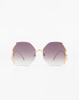 A front view of For Art's Sake® Century sunglasses with hexagonal lenses that have a gradient from dark purple to clear. The gold-plated stainless steel frames feature minimalist design with gold accents on the sides. These stylish shades offer 100% UVA & UVB protection against harmful rays. The background is plain white.