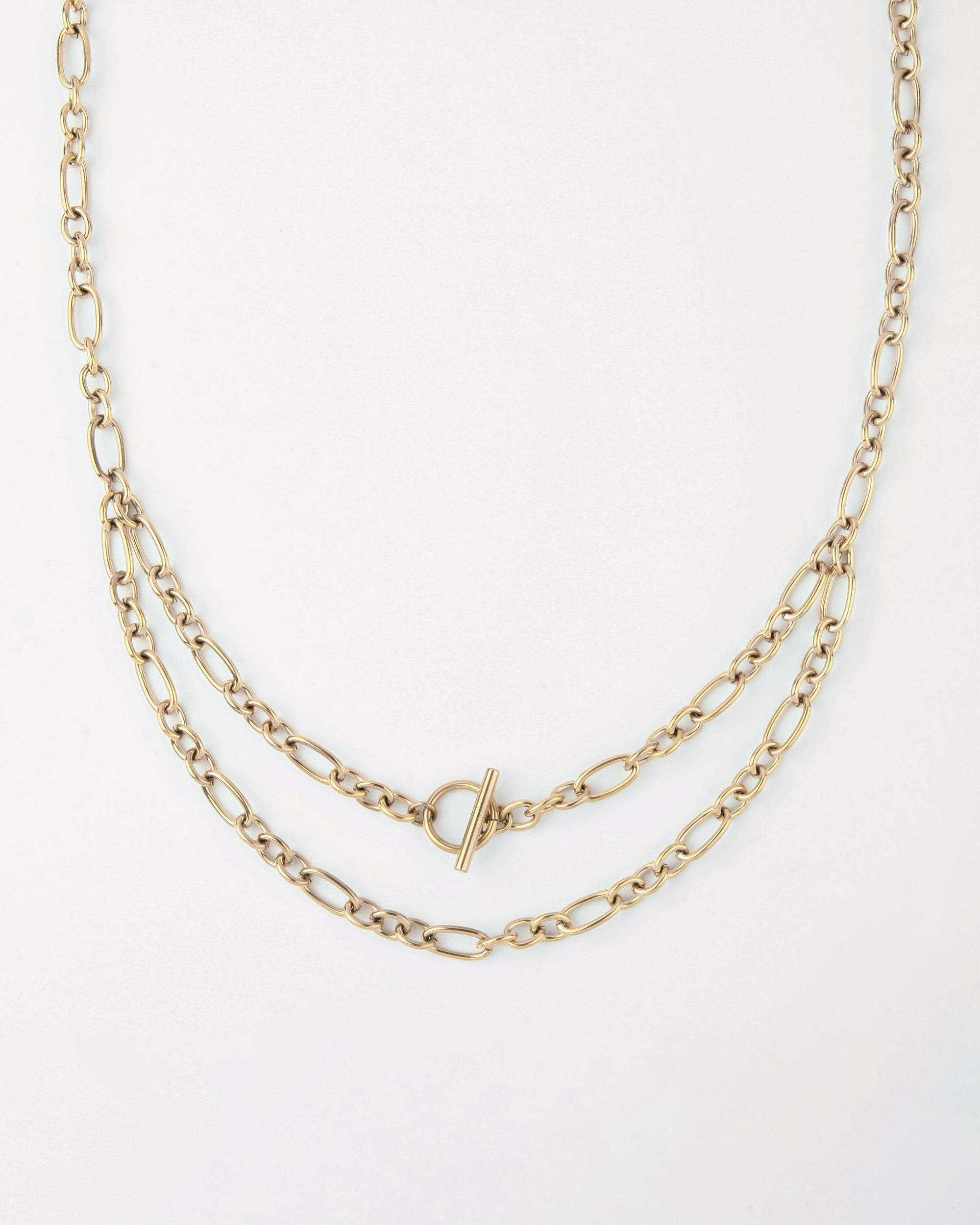 A gold-tone For Art's Sake® Clio Glasses Chain with two layers of oval links. The chain features a T-bar toggle clasp in the center, connecting both chains seamlessly against a plain white backdrop.