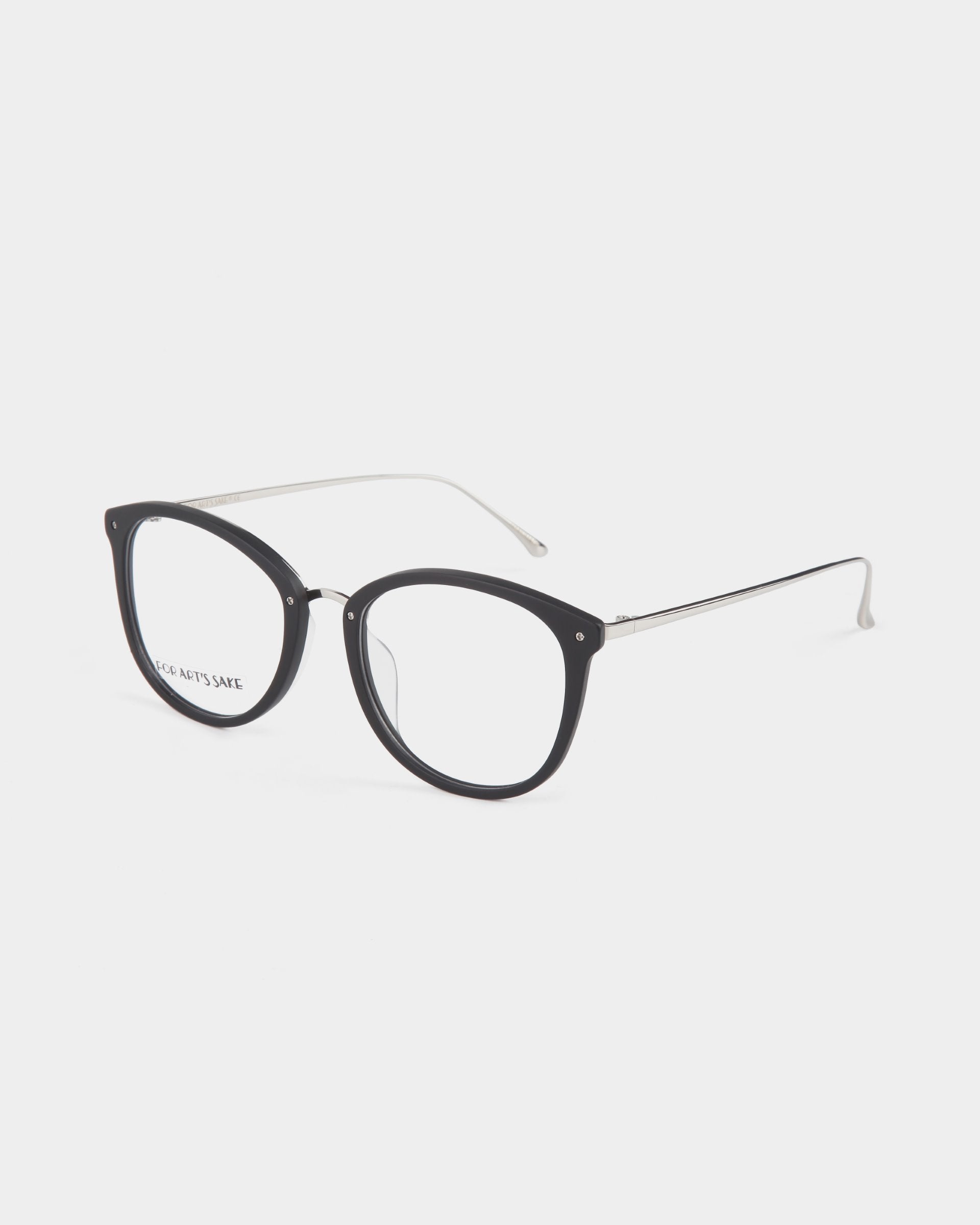 A pair of For Art&#39;s Sake® Club eyeglasses with a black, round frame and thin, metallic temples. The lenses are clear, reflecting light and equipped with a blue light filter. The background is plain white.