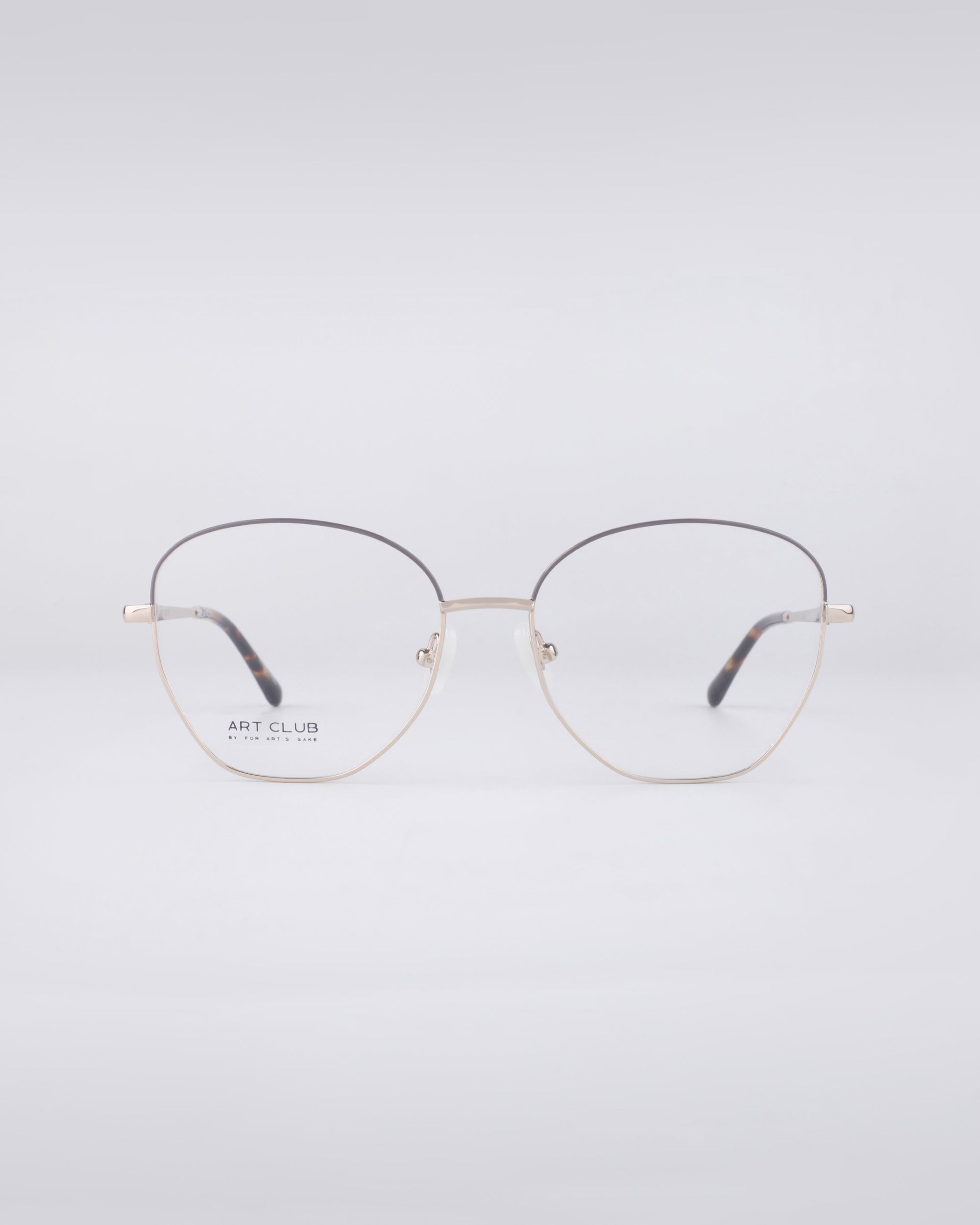 The Coco frames by For Art's Sake® are designed with a minimalist aesthetic, showcasing thin and lightweight stainless steel construction. They feature round lenses set against a plain white backdrop, with the left lens subtly displaying the text "ART CLUB" near its edge.