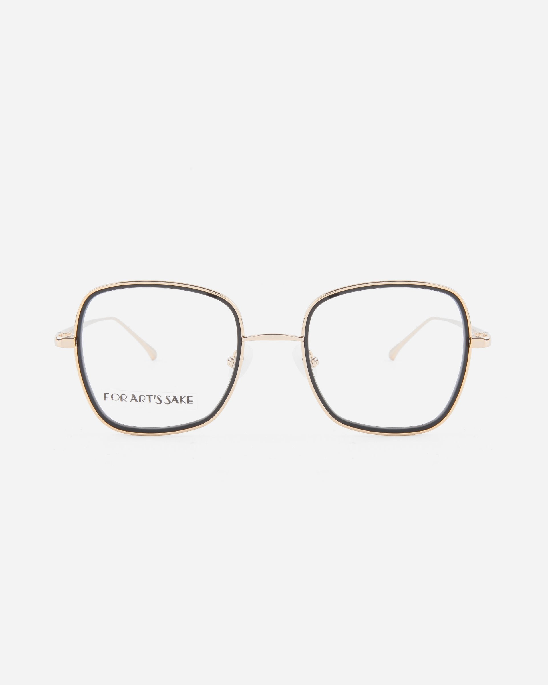 A pair of square-shaped, thin-framed eyeglasses with a gold metal frame and clear ultra-lightweight lenses. The brand name "For Art's Sake®" is printed on the inside of the left lens. The product name "Coconut" is associated with this stylish accessory. The background is plain white.
