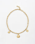 The For Art's Sake® Daisy Necklace Gold is a 24-karat gold plated chain necklace with a starfish charm, a central charm featuring a freshwater pearl encased in a gold setting, and a daisy flower charm. The necklace has an adjustable clasp closure.