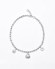 The For Art's Sake® Daisy Necklace Silver is a delicate silver chain necklace featuring three small charms: a star, a circular swirl, and a flower. The chain has a lobster clasp with an adjustable extender for length. Each charm is accented with 24-karat gold plating, creating a subtle contrast against the plain white background.