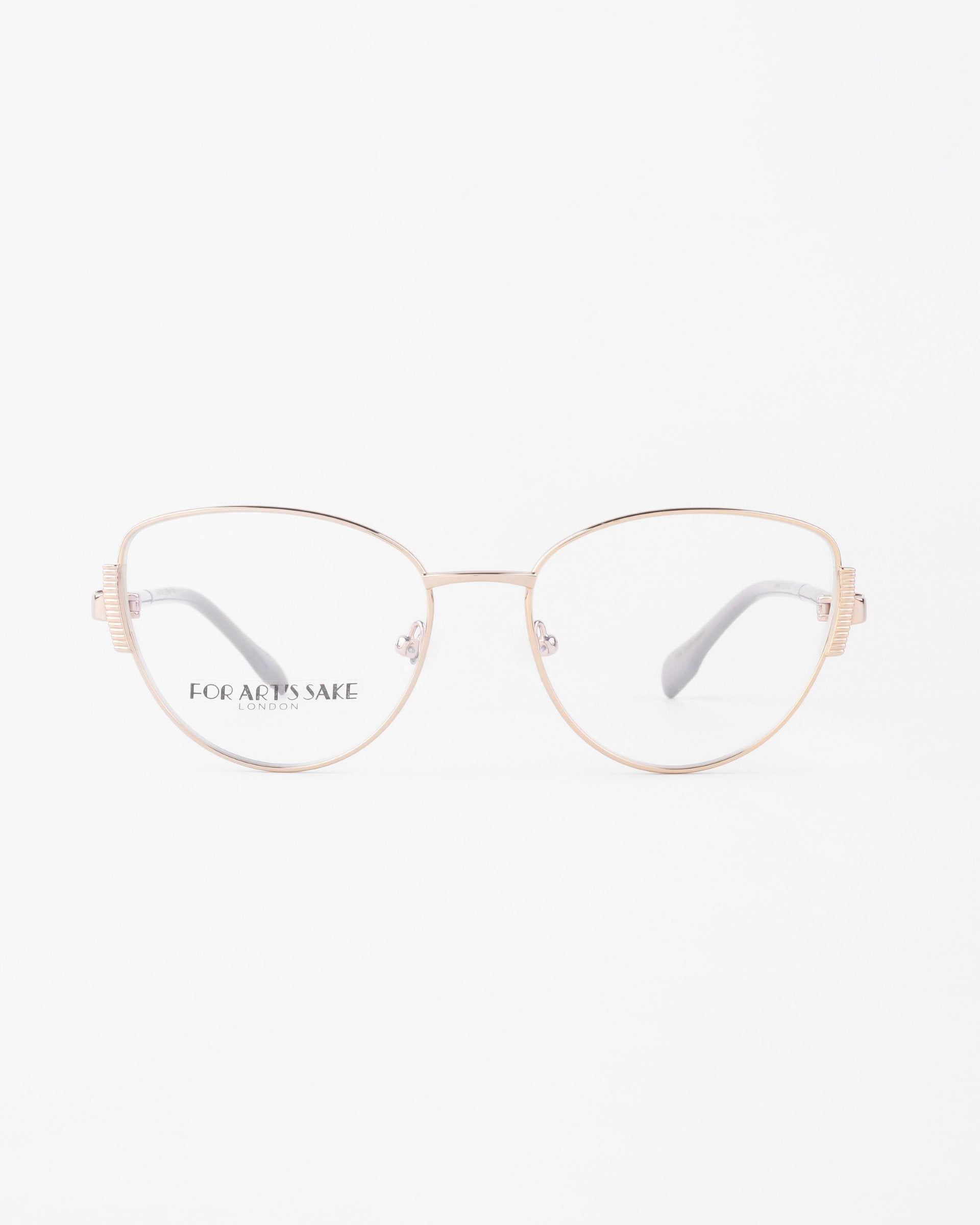 A pair of delicate, gold-framed eyeglasses with round lenses and prescription lenses. The frames are thin and minimalistic, with a slight cat-eye shape and jade stone nose pads. The words &quot;For Art&#39;s Sake®&quot; are etched on the left lens. The background is white.