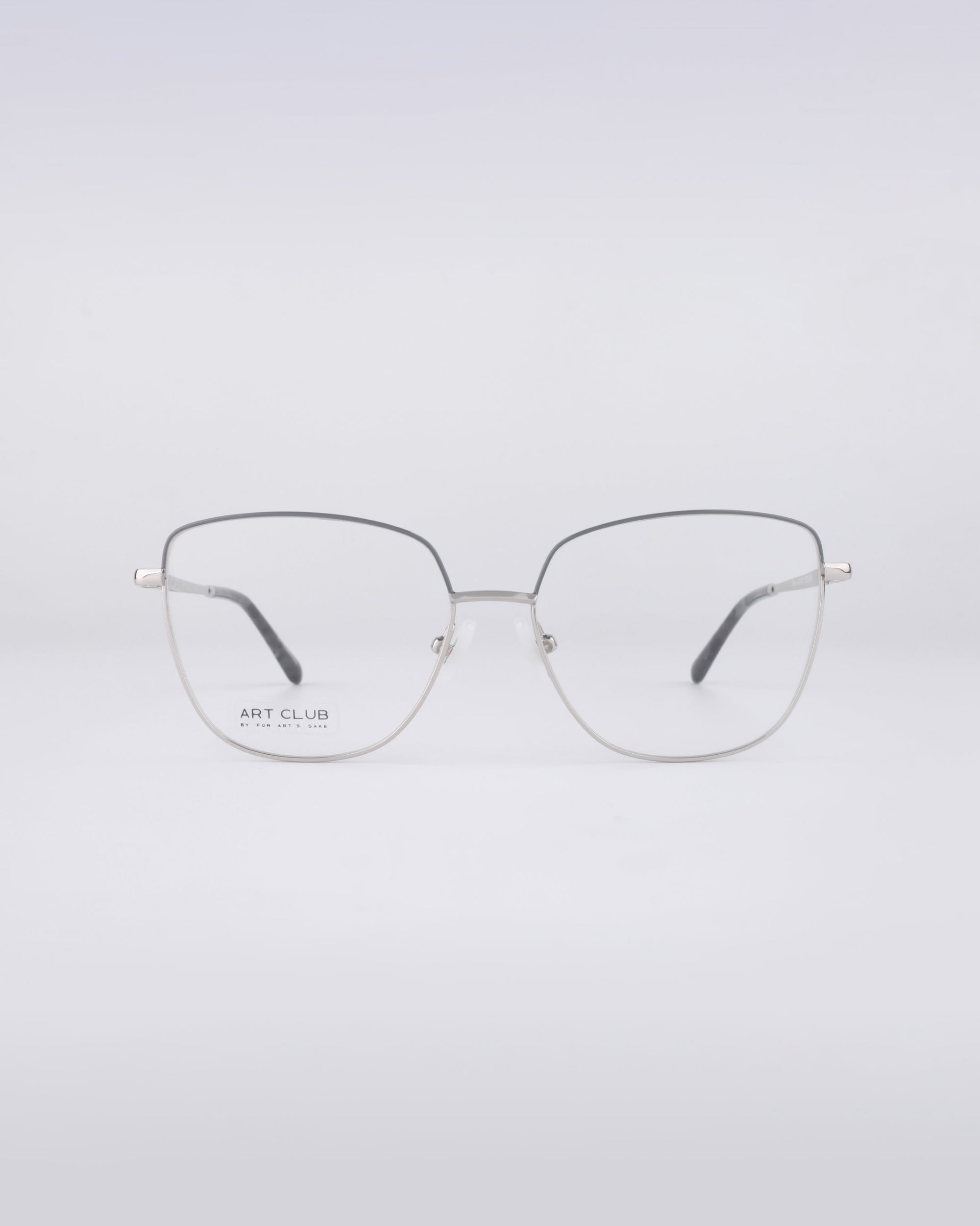 A pair of For Art's Sake® Dora frames, crafted with a thin metal structure and rectangular lenses, is beautifully presented against a simple white backdrop. The sleek design features the "Art Club" text on the left lens, while blue light filter lenses offer a contemporary flair to these stylish eyeglasses.