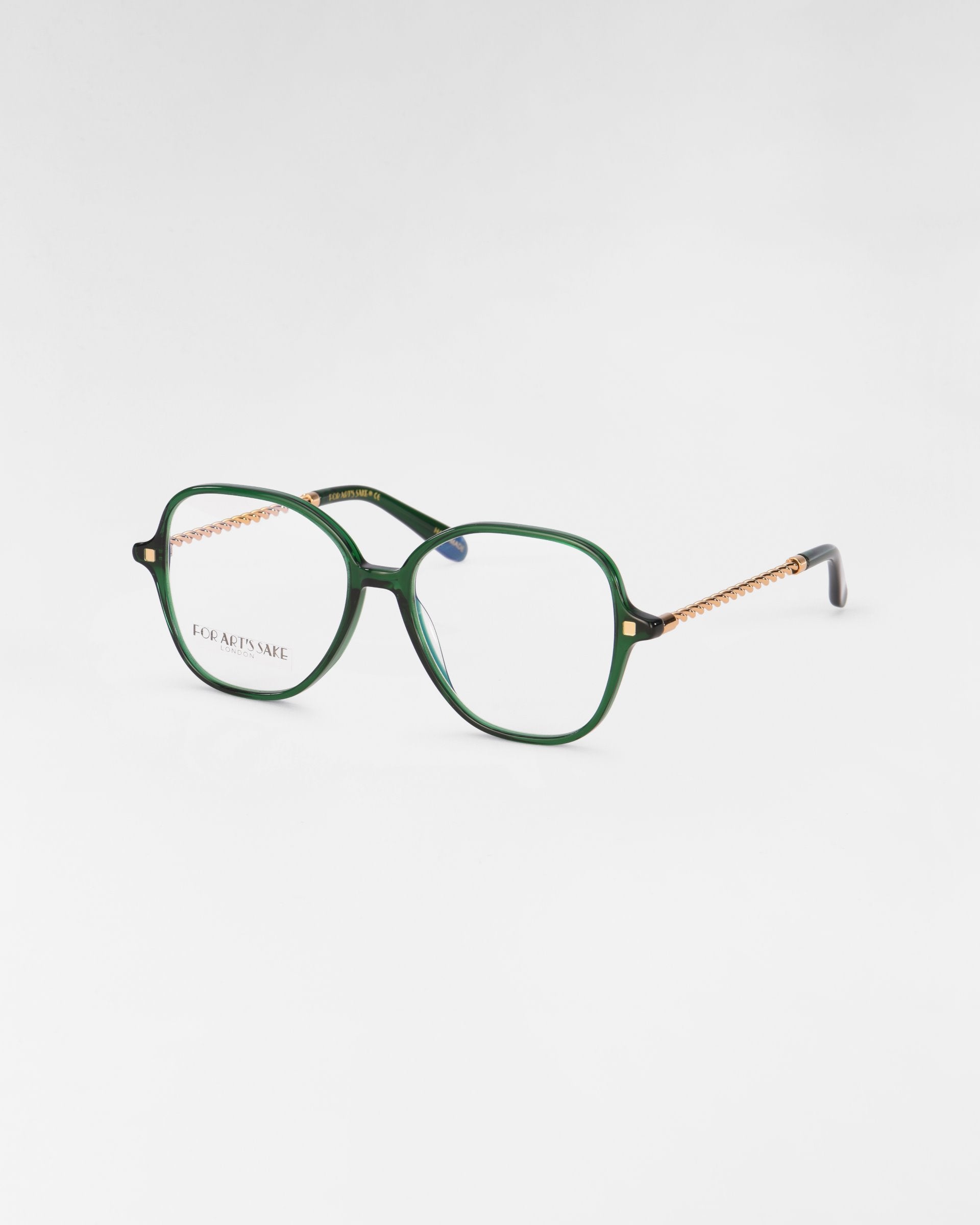 A pair of For Art's Sake® Dumpling eyeglasses with green rectangular frames and transparent lenses featuring a blue light filter. The temples are adorned with a textured gold pattern and have black tips. The product is displayed on a plain white background.