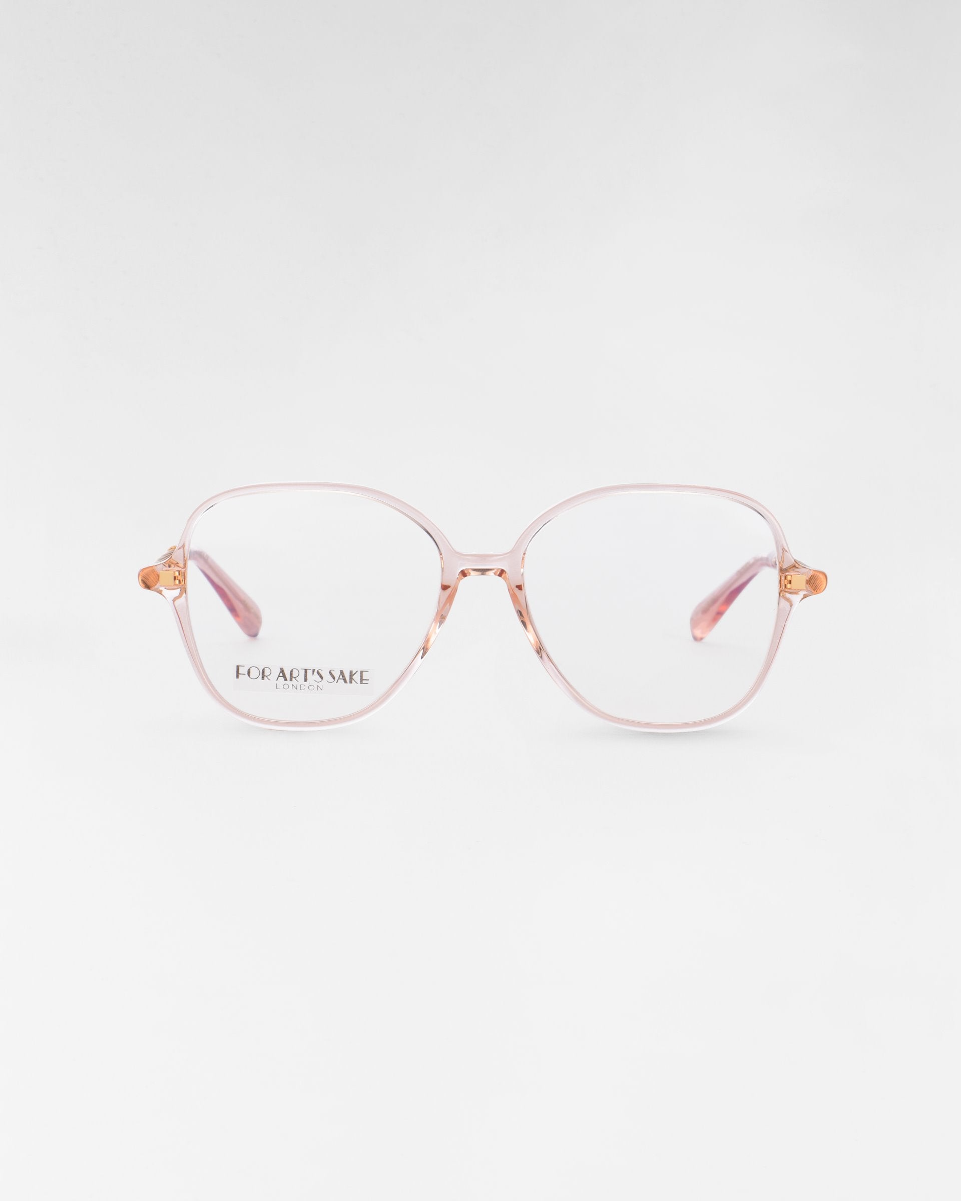 A pair of eyeglasses with large, round lenses and thin, light pink frames. The brand name &quot;For Art&#39;s Sake®&quot; is written in small letters on the left lens. Featuring a blue light filter, these Dumpling glasses are displayed against a plain, white background.