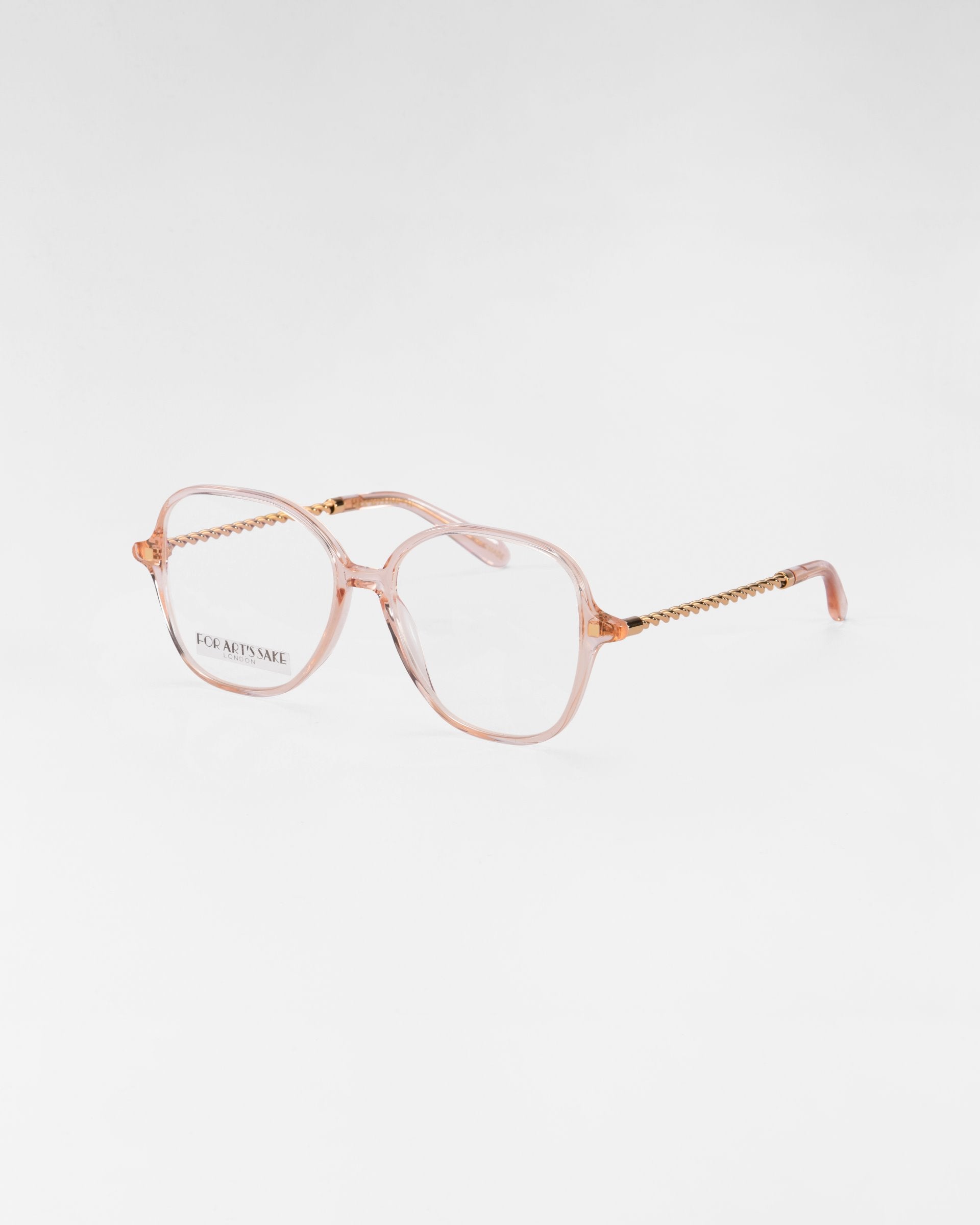 A pair of eyeglasses with translucent pink frames and gold chain-like detail on the temples featuring clear lenses with a subtle blue light filter. The brand name &quot;For Art&#39;s Sake®&quot; is visible on the left lens, all set against a plain white background.
