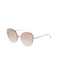 A pair of stylish, oversized cat-eye sunglasses with round, gradient lenses transitioning from light pink to gray. They feature thin, rose gold frames and a unique design on the hinges. The temples are slender with a delicate and modern look. These are the Girlboss by For Art's Sake®.