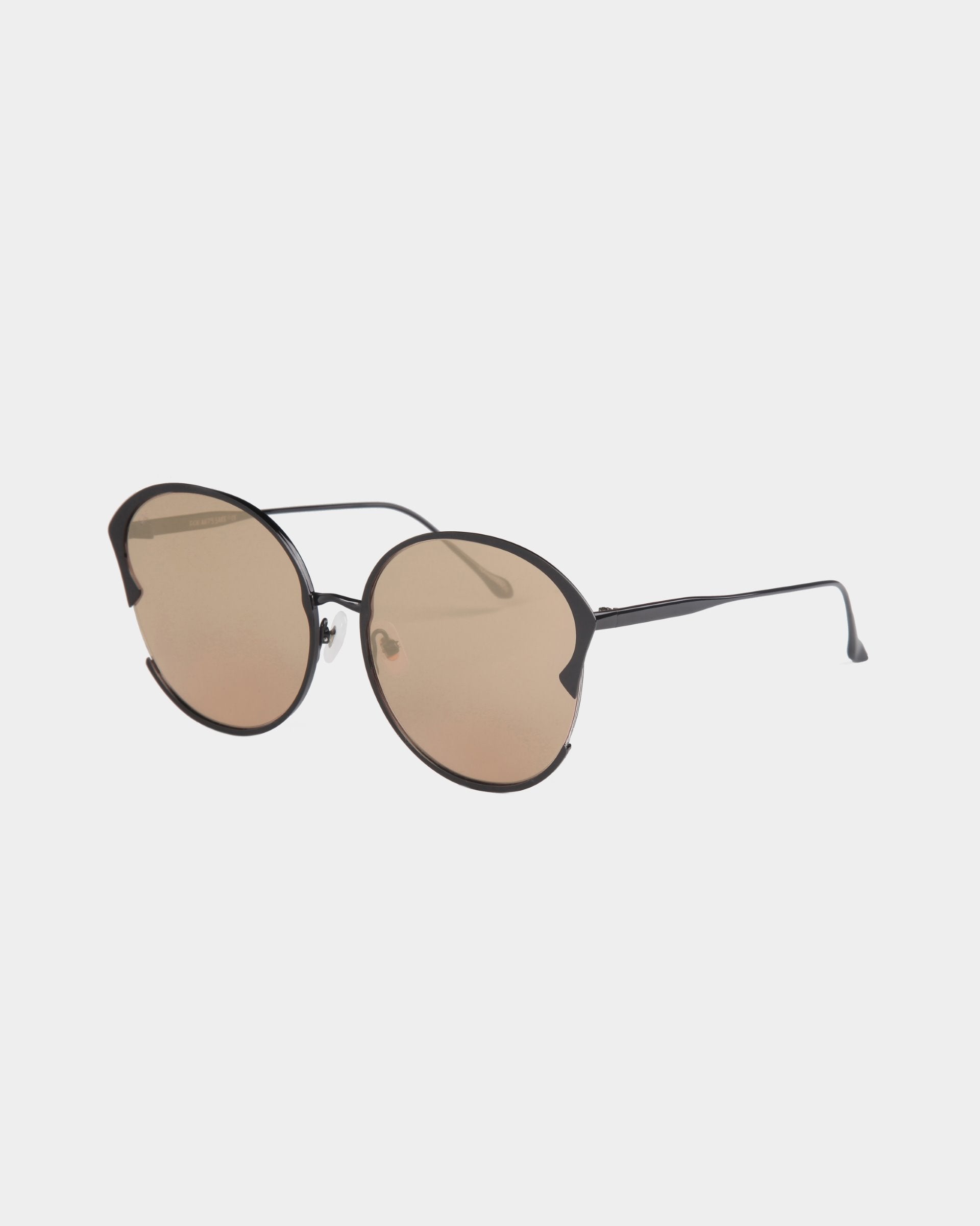 A pair of stylish For Art&#39;s Sake® Alectrona sunglasses with round brown-tinted, shatter-resistant lenses and a thin black metal frame. The design features a minimalist bridge and temple arms, with adjustable jade nose pads for comfort. The background is plain white.