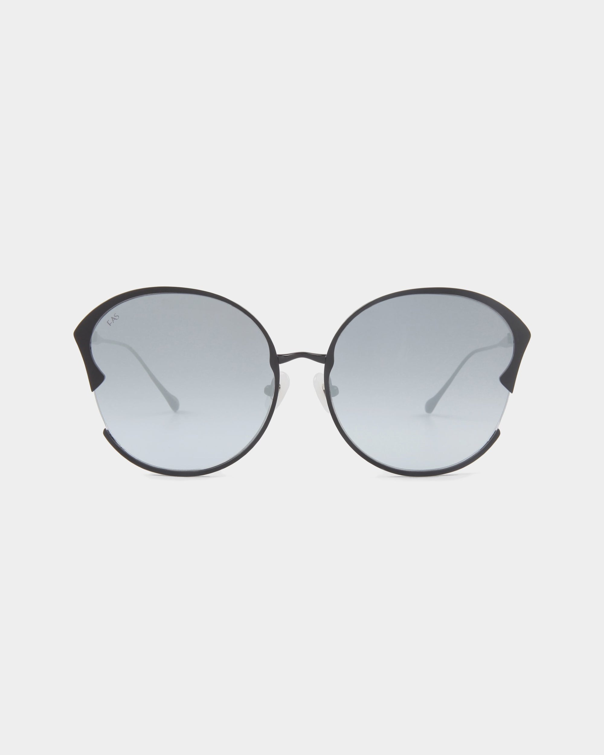 The Alectrona by For Art's Sake® are round sunglasses featuring thin black frames, slightly tinted grey nylon lenses, and decorative curved accents on the top outer corners. The UVA & UVB-protected lenses promise superior defense. The background is plain white.

