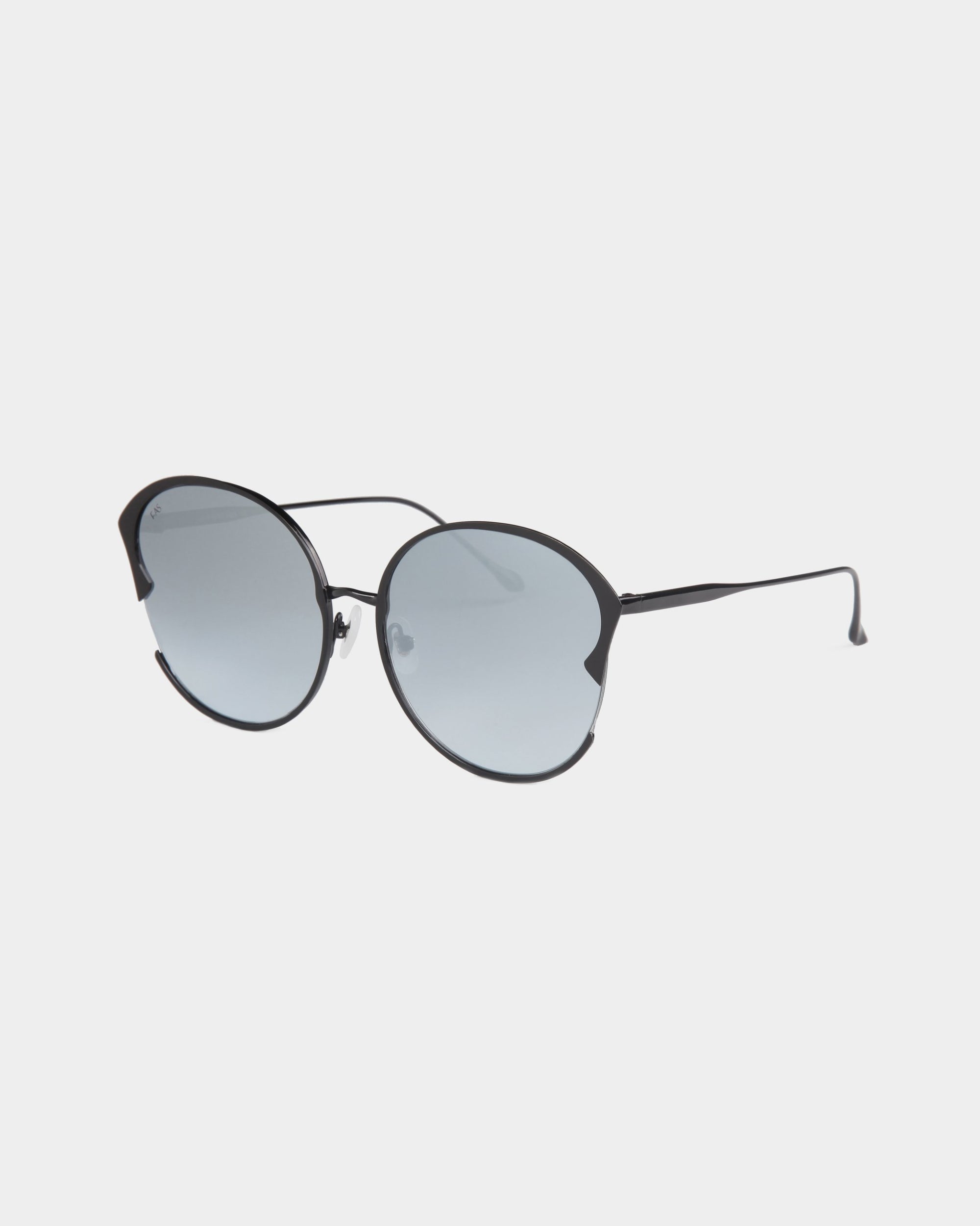 A pair of For Art&#39;s Sake® Alectrona round, black-framed sunglasses featuring dark tinted, UVA &amp; UVB-protected lenses. The Alectrona sunglasses boast thin metal arms and a sleek, minimalist design. They come with a chic faux leather case. The image is set against a plain white background.