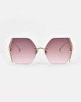 Minimalist Generation sunglasses by For Art's Sake® with large, gradient purple-tinted hexagonal lenses and thin gold-plated stainless steel frames. These stylish sunglasses offer UV protection and have no visible nose pads, providing a modern and sleek design. The background is white, emphasizing the chic eyewear.