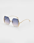 A pair of stylish **Generation by For Art's Sake®** sunglasses with gold-plated stainless steel wireframes and gradient blue lenses. The square lenses have slightly rounded edges, offering UV protection. The minimalist design features thin arms, jadestone nosepads, and no visible branding against a plain white background.