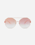A pair of For Art's Sake® Mania sunglasses with rose-tinted gradient nylon lenses and thin 18-karat gold-plated frames. The lenses are hexagonal in shape, and there are pink accents on the sides of the frames near the hinges. The background is plain white.