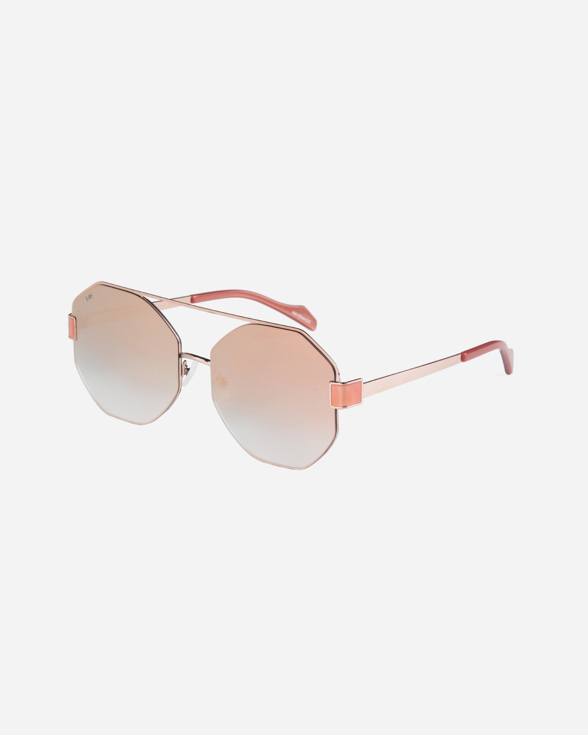 A pair of stylish **For Art&#39;s Sake® Mania** sunglasses with hexagonal stainless steel frames in rose gold, featuring slightly gradient nylon lenses that transition from pink to a lighter hue. The arms are slender with matching rose gold detailing and pink temple tips, plus adjustable nosepads for added comfort.