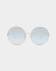 A pair of Quartz sunglasses by For Art's Sake® featuring round, frameless lenses with a light blue nylon tint. These minimalist and modern sunglasses are designed with thin stainless steel temples and a simple bridge, providing stylish UVB protection for sunny days.