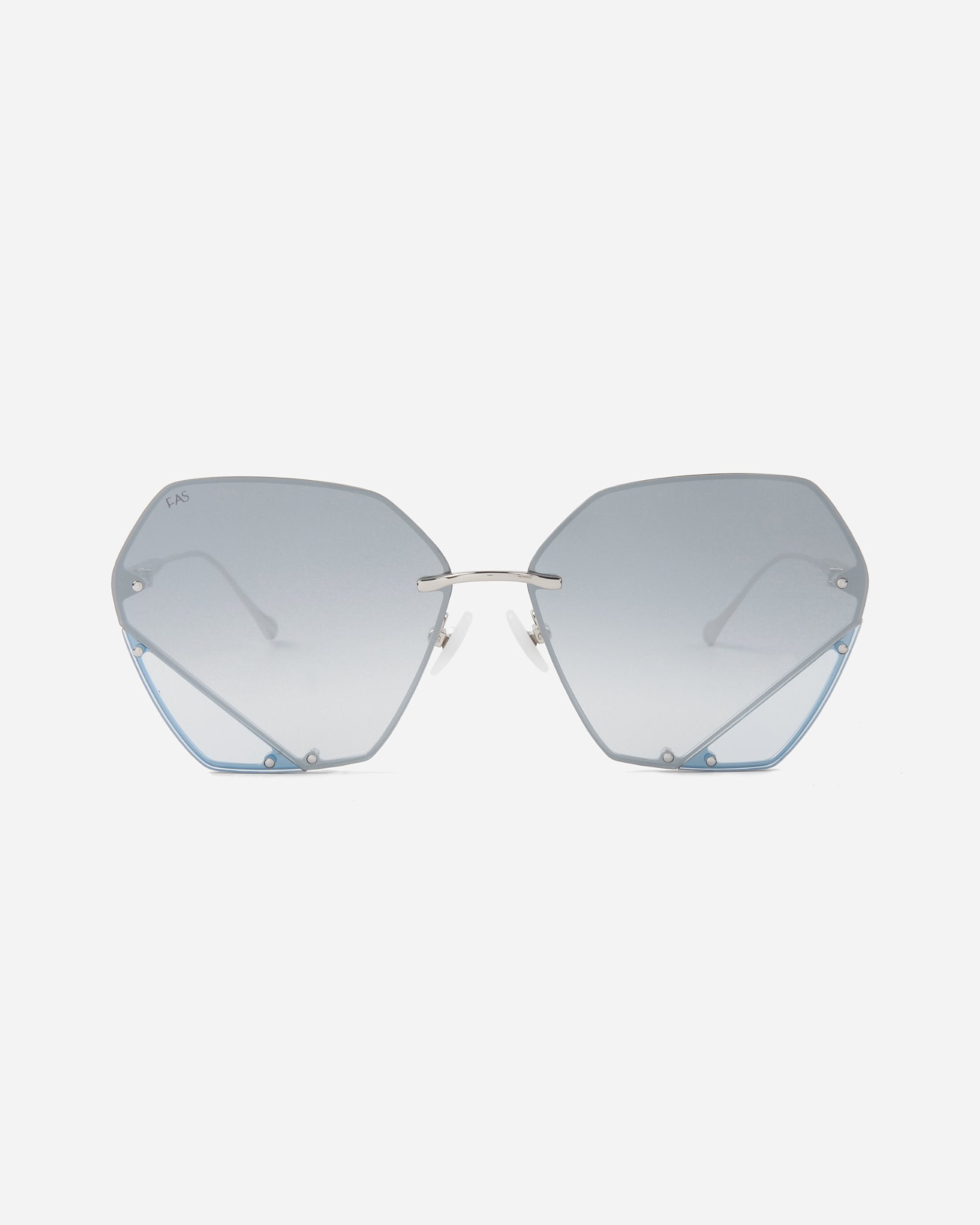 Hexagon-shaped Icy sunglasses with blue tinted lenses and sleek metal frames by For Art&#39;s Sake® on a white background. The design is minimalist with light blue accents at the bottom corners of the geometric lenses, jadestone nosepads, and UV protection.