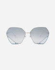 Hexagon-shaped Icy sunglasses with blue tinted lenses and sleek metal frames by For Art's Sake® on a white background. The design is minimalist with light blue accents at the bottom corners of the geometric lenses, jadestone nosepads, and UV protection.