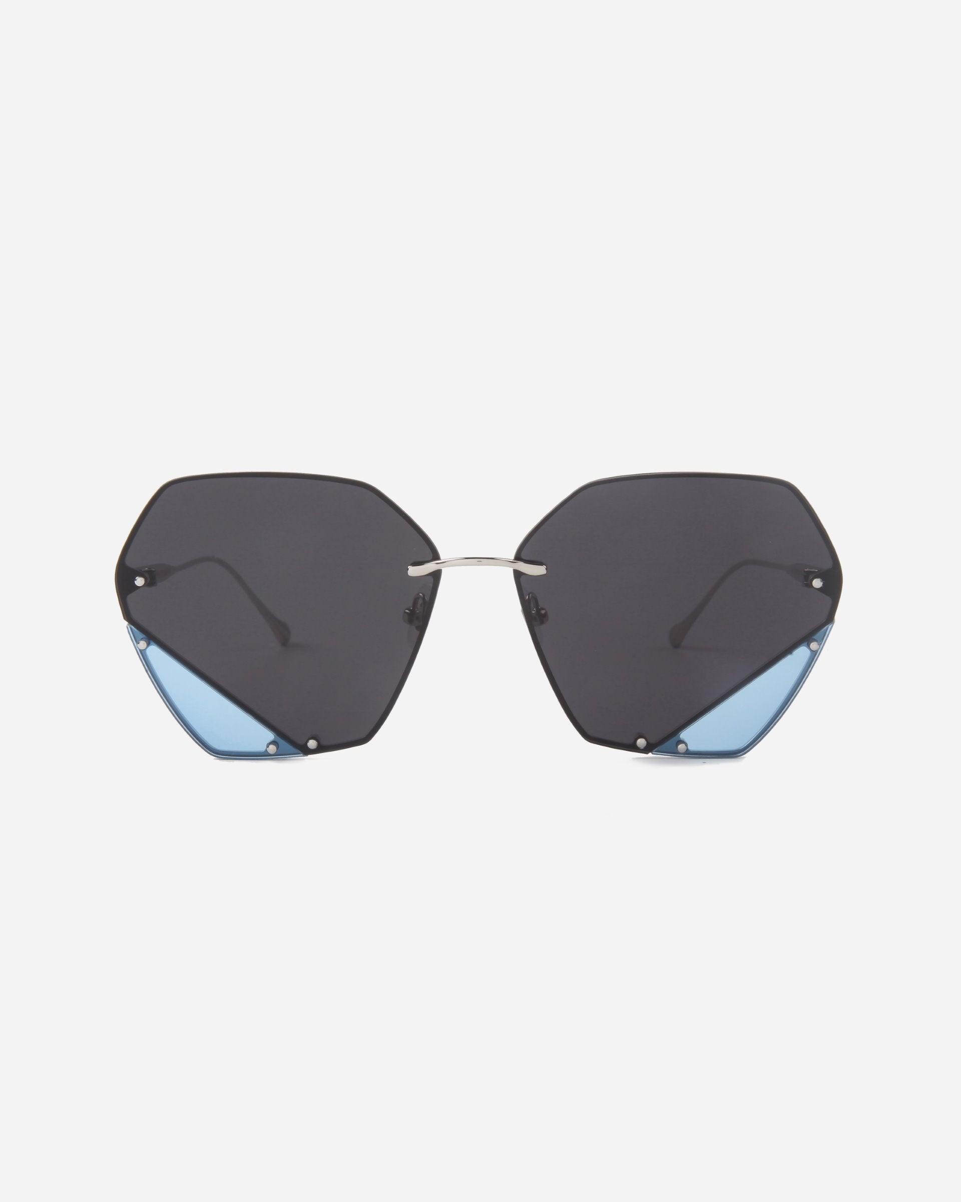 A pair of sunglasses featuring uniquely shaped, geometric lenses with angular cuts and a hint of light blue tint at the lower corners. The bridge is minimalistic and silver-toned, complemented by jadestone nosepads, with no visible frame around the lenses. The product is Icy by For Art's Sake®. The background is white.