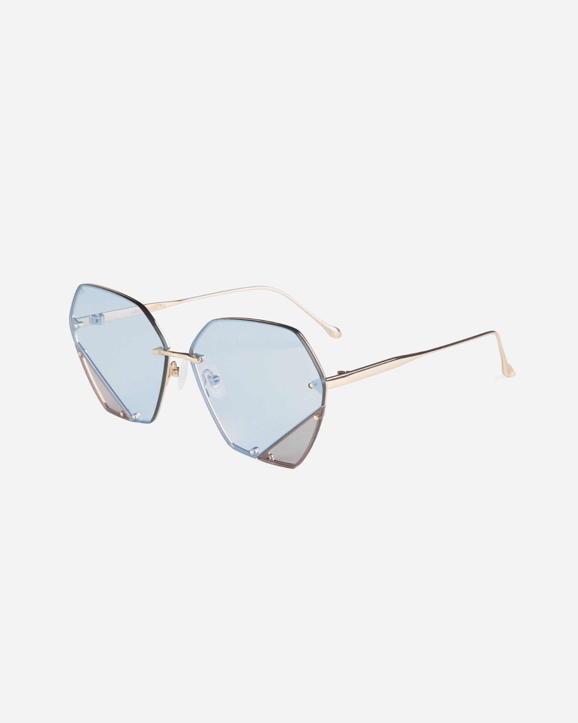 A stylish pair of For Art&#39;s Sake® Icy sunglasses featuring geometric, light blue-tinted lenses and thin, gold metal frames with jadestone nosepads, set against a plain white background.